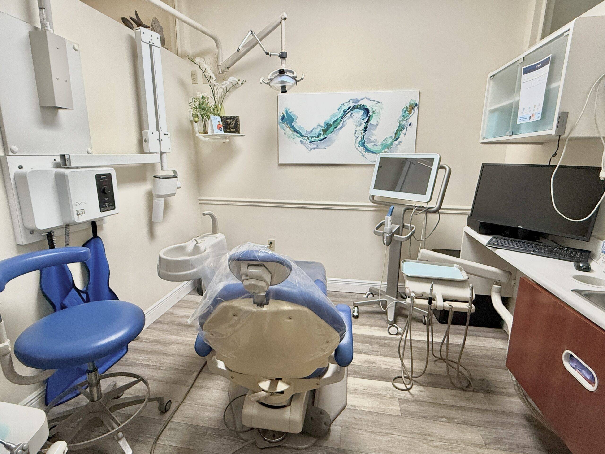 emergency dental clinic examining patient with digital X-ray equipment